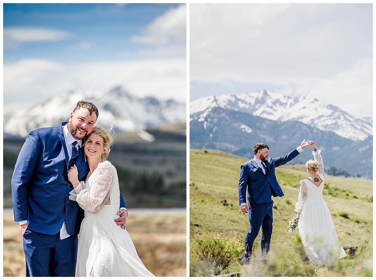 Bride and groom standing in a grassy field during an elopement in Yellowstone National Park with mountains behind them.