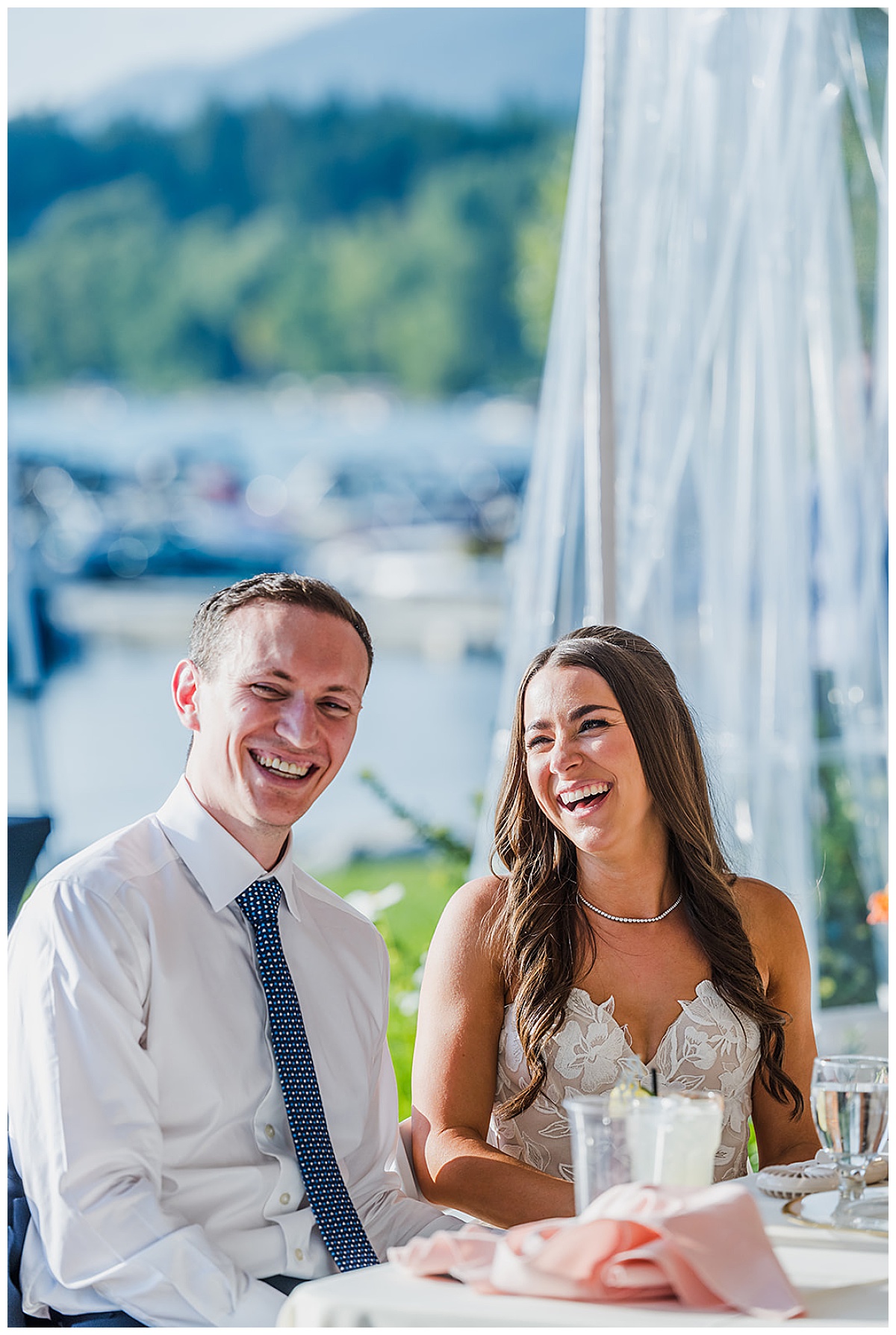 Bride and Groom smiling during their wedding reception at The Lodge at Whitefish Lake, in Whitefish, MT.